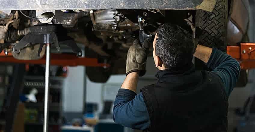 Experienced Burnaby mechanic repairing vehicle